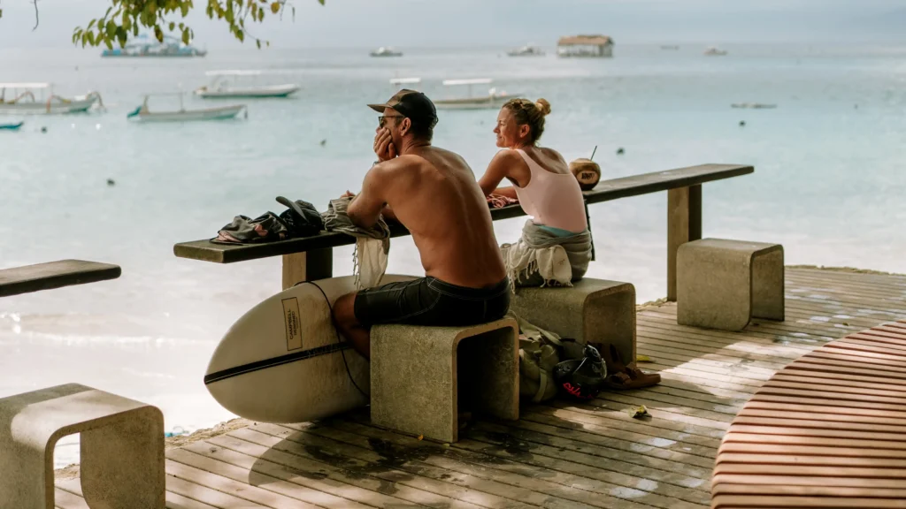 Lago acoustic live music on Sundays at Dawn, Nusa Dua. People sitting on beach