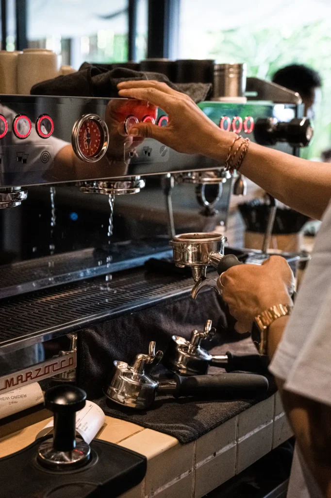 Barista pulling a shot on the La Marzocco espresso machine at Dawn cafe Lago Nusa Lembongan