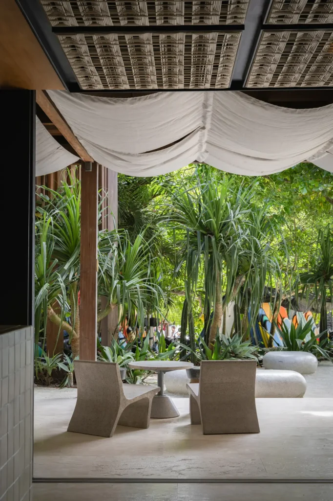 Cafe entrance with bamboo and canvas ceiling and pandan trees at Dawn Lago Nusa Lembongan