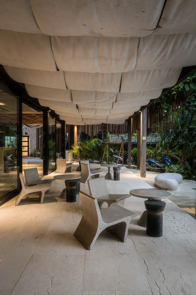 Outdoor seating in evening light under canvas drape ceiling at Dawn cafe Lago Nusa Lembongan