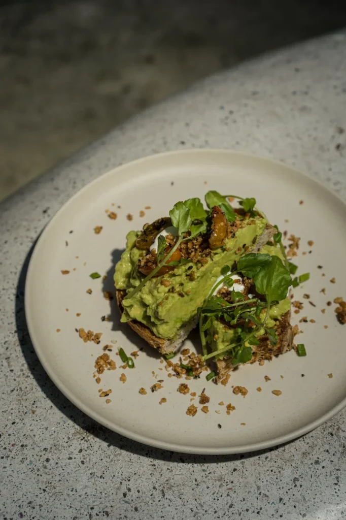 Whipped feta, smashed avo, macadamia dukkah, cherry tomato, multigrain sourdough at Dawn cafe Lago Nusa Lembongan